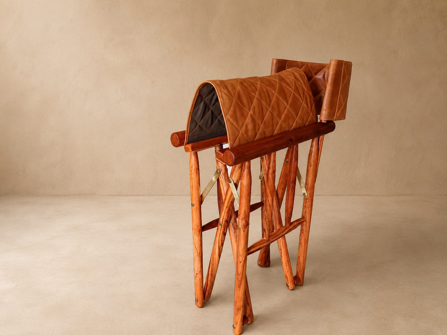The Kruger Luxury Safari Director's Chair Folded A folded Kruger Luxury Safari Director's Chair made from Zambezi Teak and leather seat cover