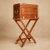 The Stanley Luxury Field Bar in Zambezi teak seated on a campaign tray table