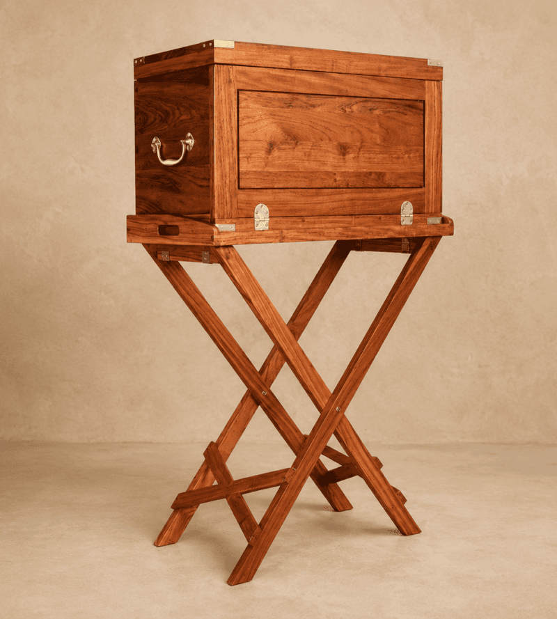 The Stanley Luxury Field Bar in Zambezi teak seated on a campaign tray table