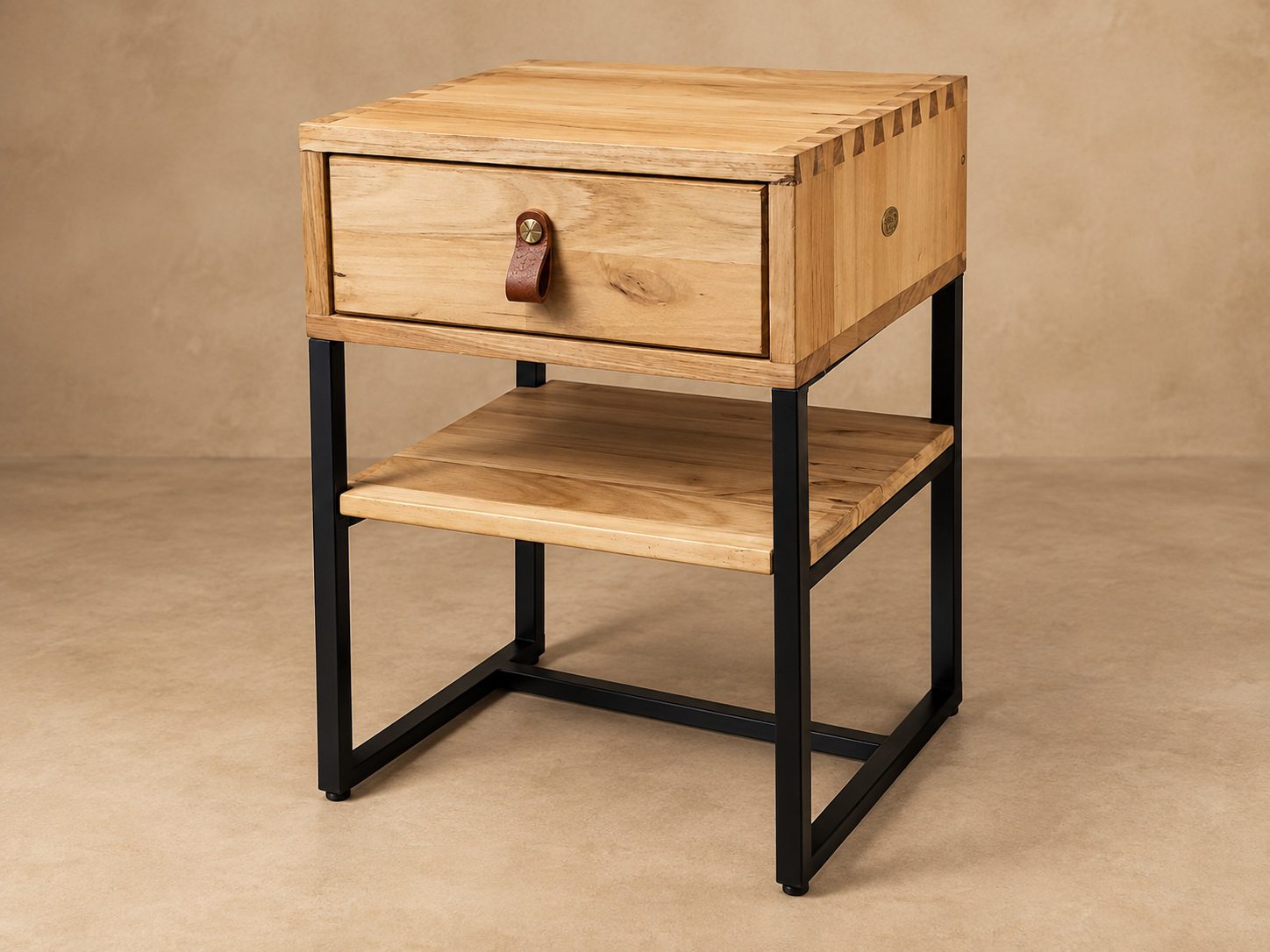 Samanzi-hardwood-bedside-table Samanzi Bedside Table in hardwood and black steel with drawer, leather pull and open lower shelf.